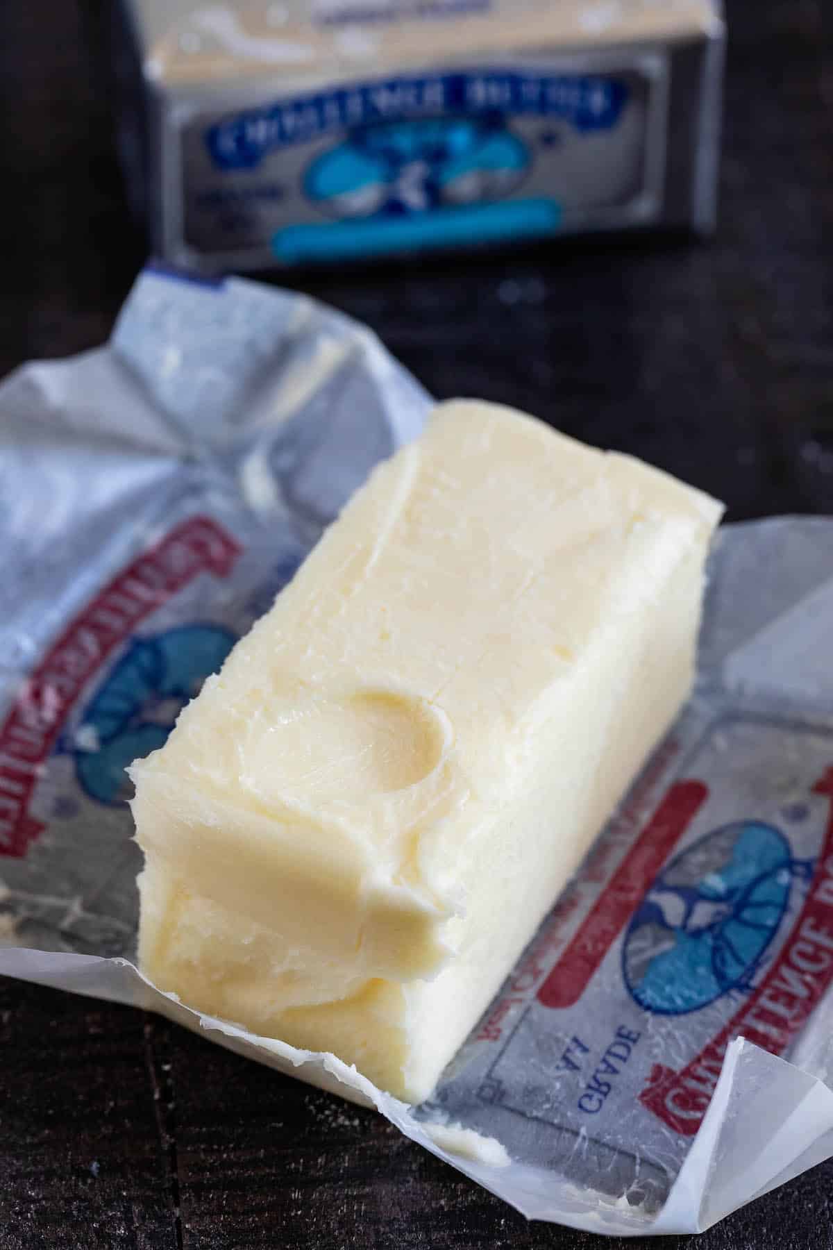 softened butter on wrapper with finger print.