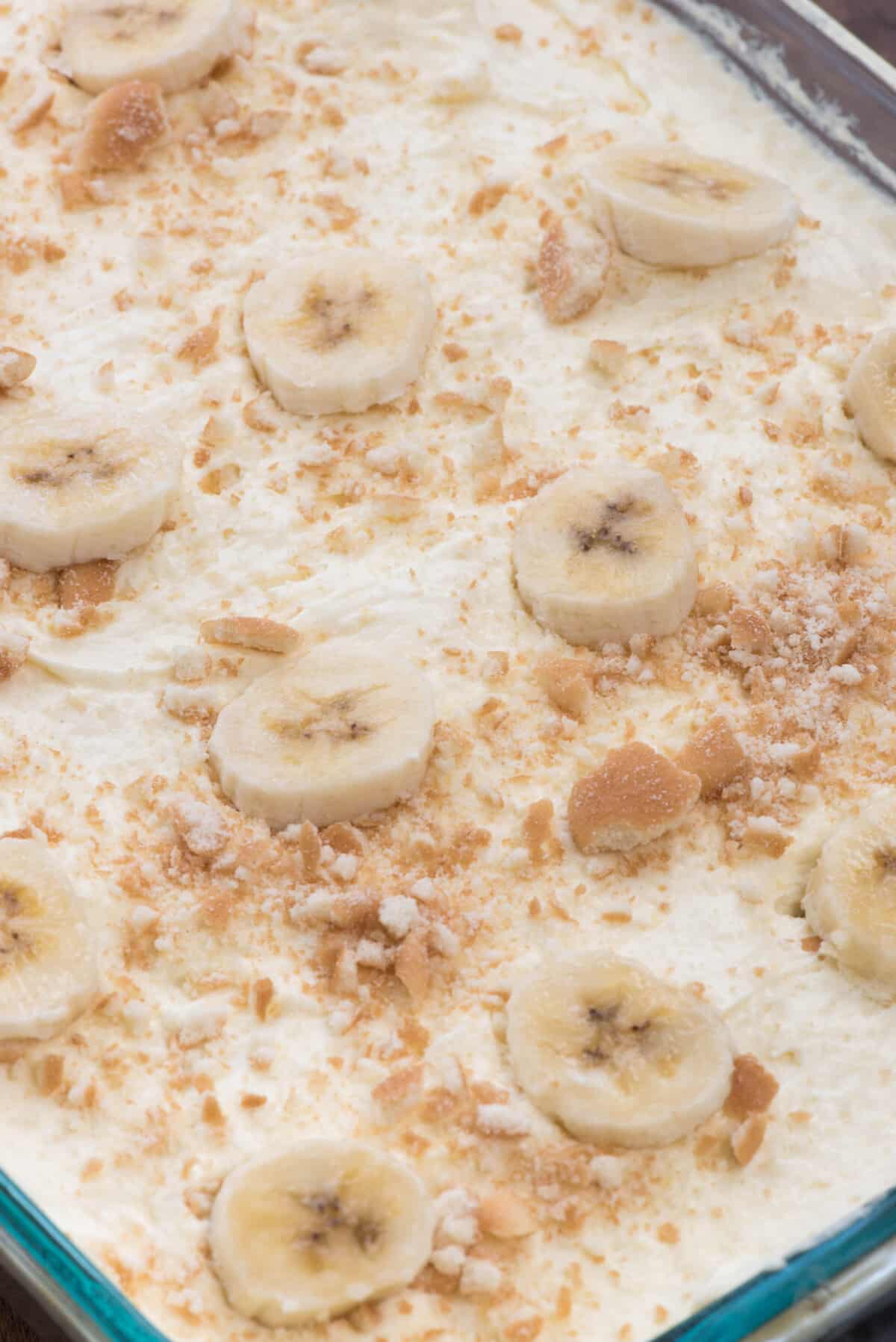 pudding cake with slices of bananas on top.