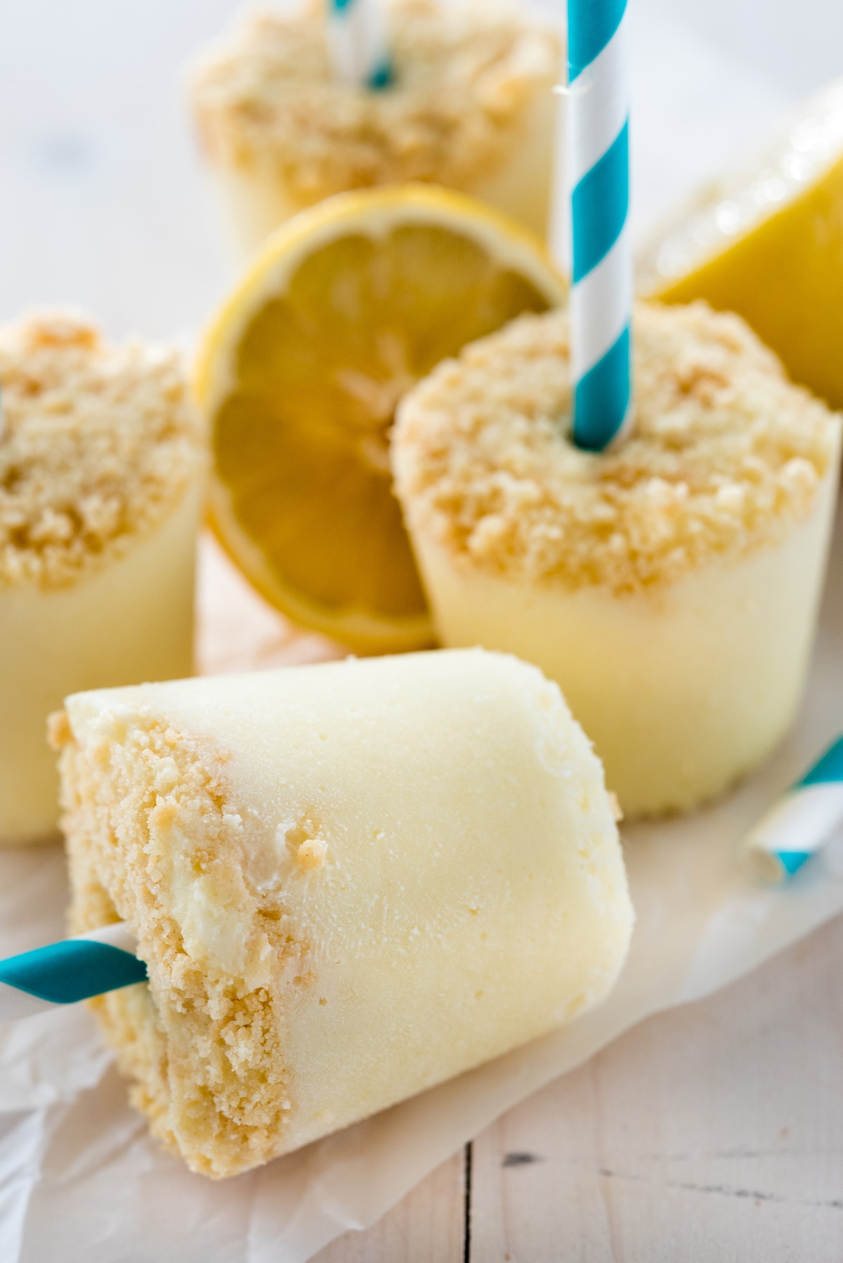 lemon pop attached to blue and white swirled straw.