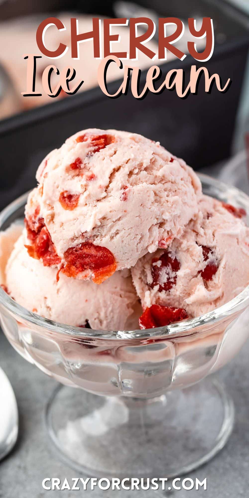 three scoops of cherry ice cream in a clear ice cream bowl with words of the image.