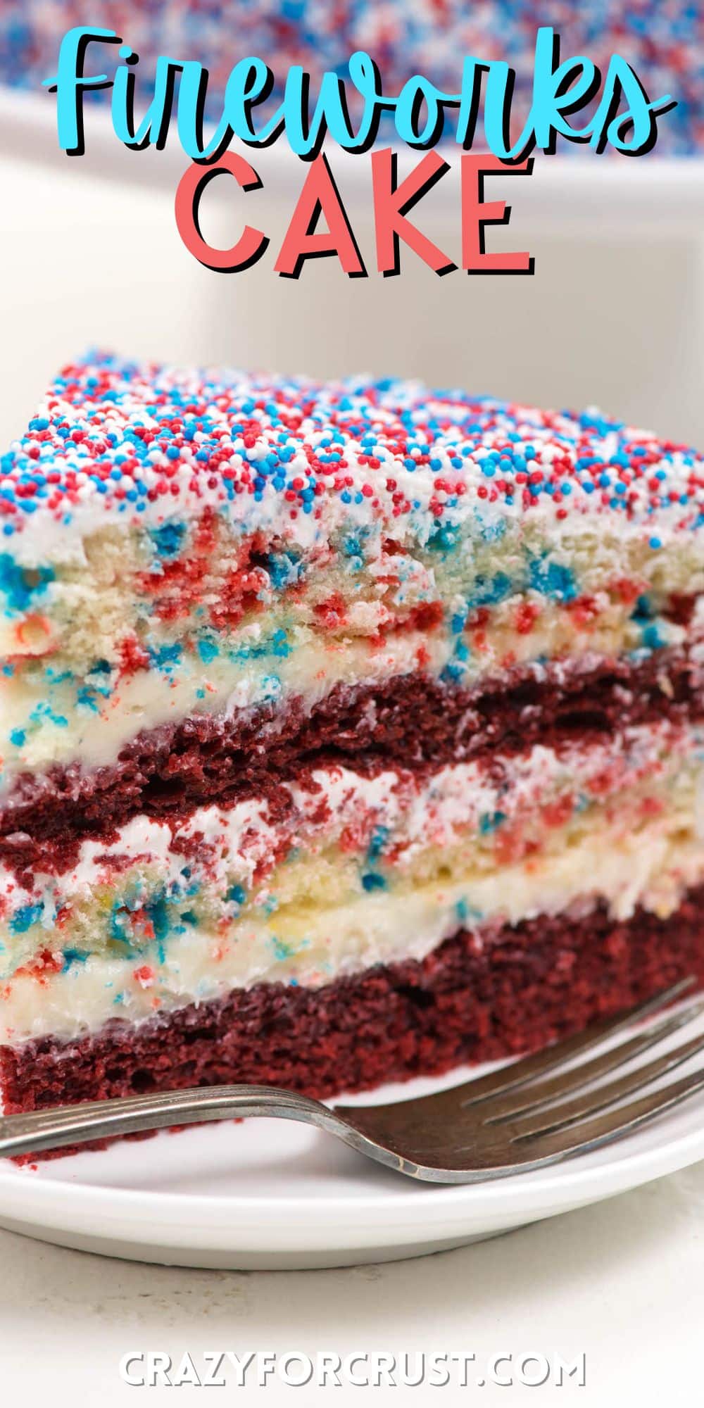yellow and red layered cake covered in patriotic sprinkles on a white plate with words on the image.
