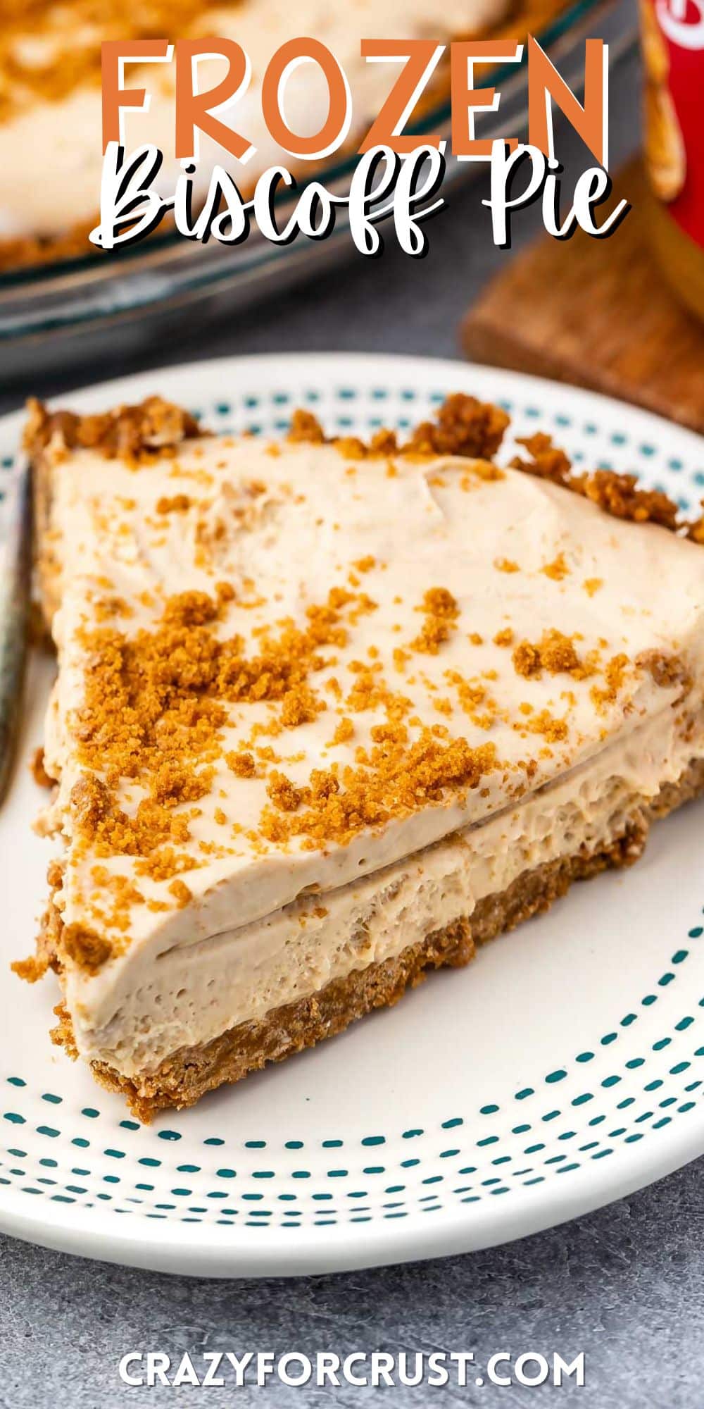 slice of pie on a white plate with biscoff crumble on top with words on the image.