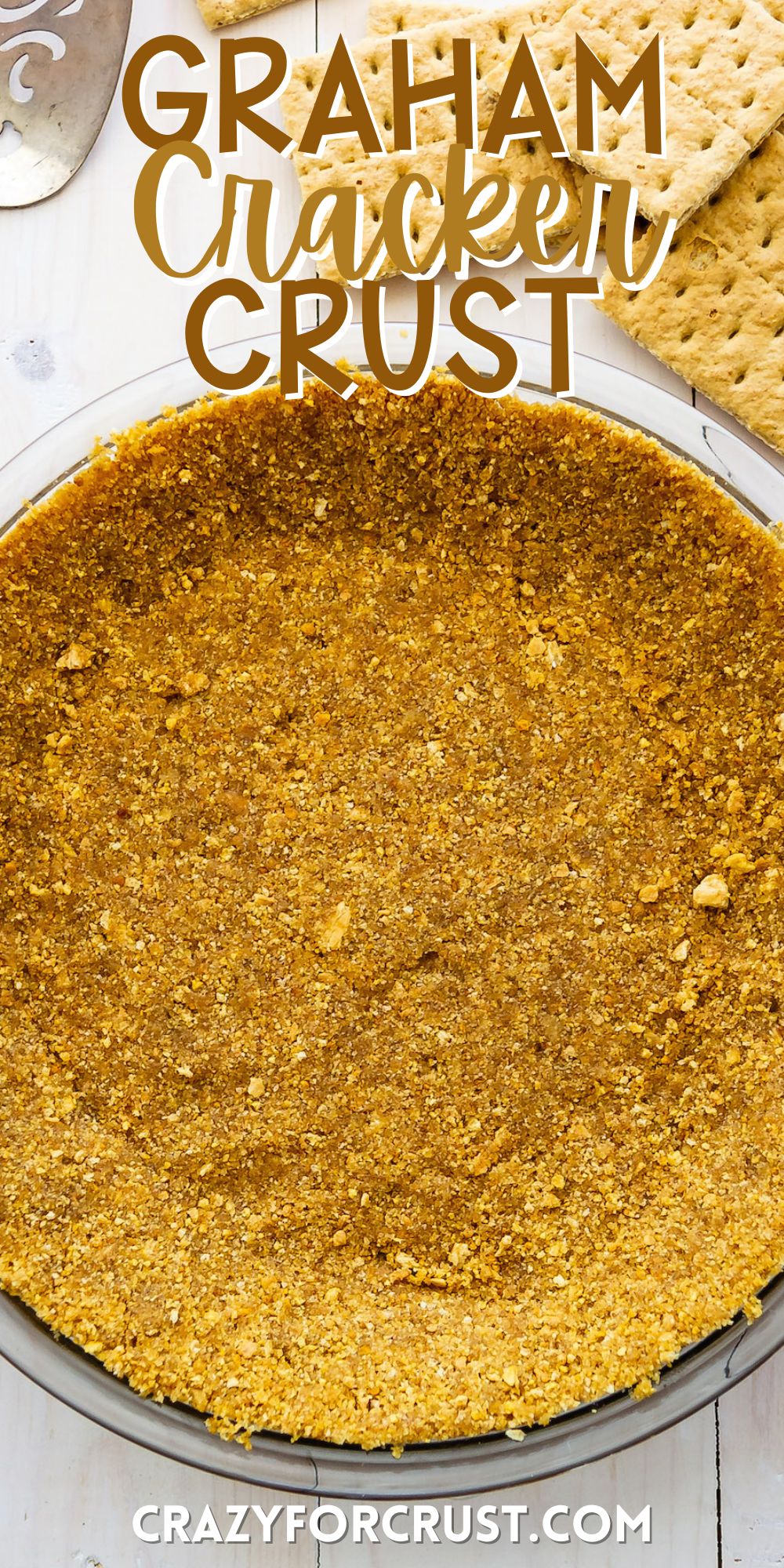 graham cracker crust in a clear pie container with words on the image.