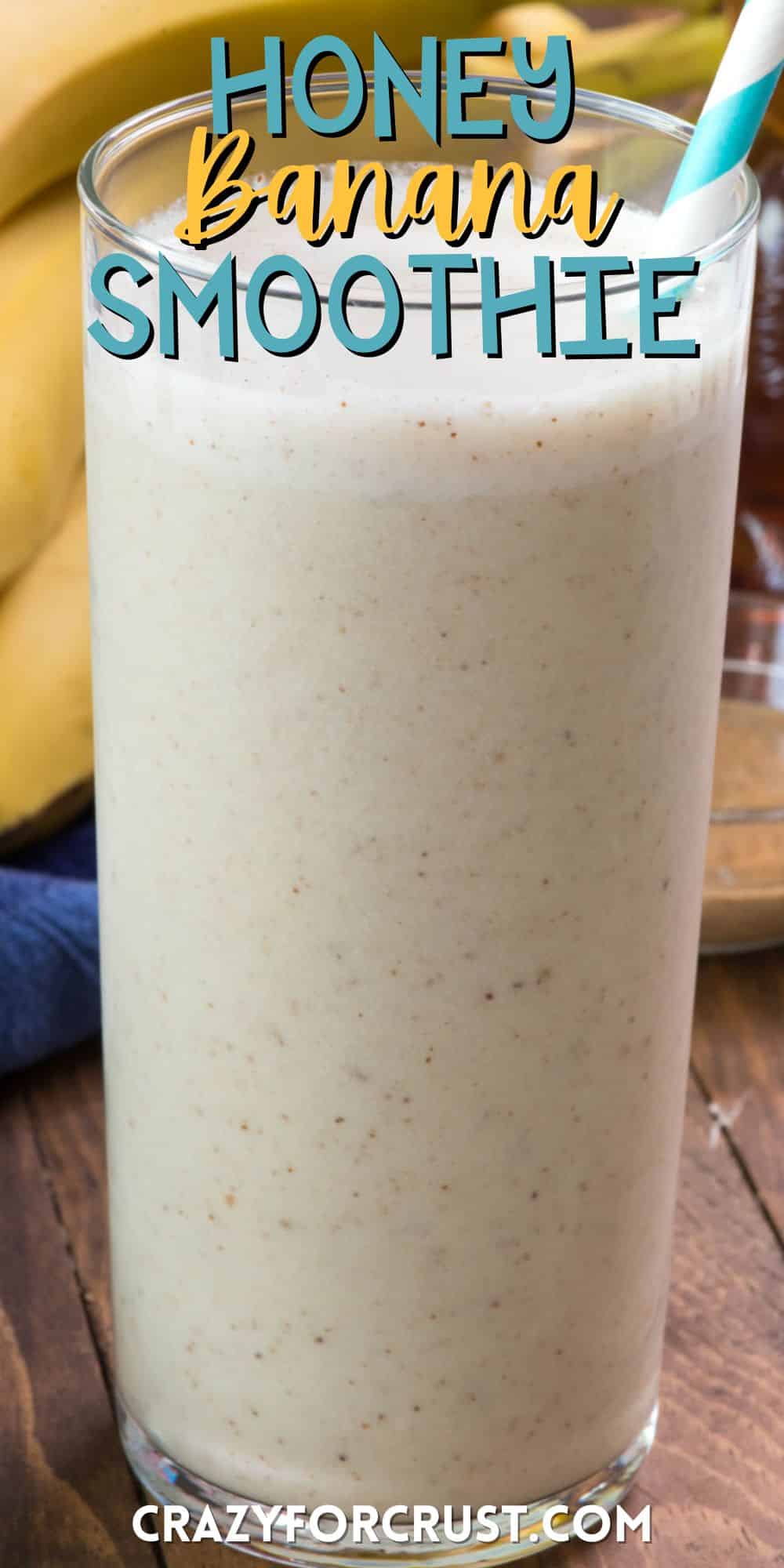 smoothie in a tall clear glass with a blue and white swirled straw in the drink with words on the image.