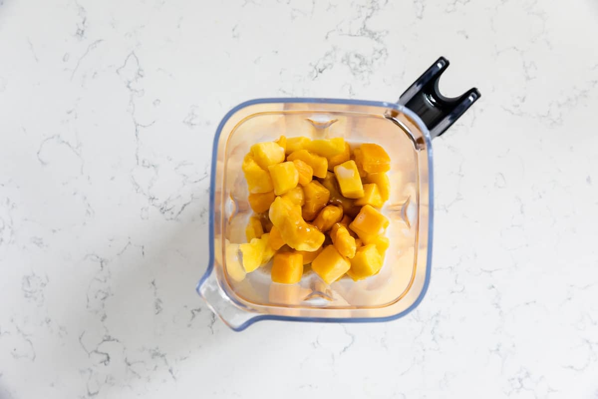 chopped mango in a blender.