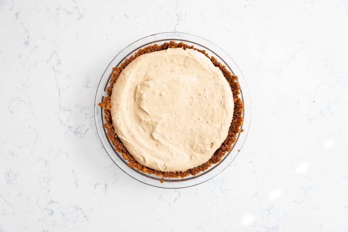 process shot of frozen biscoff pie.