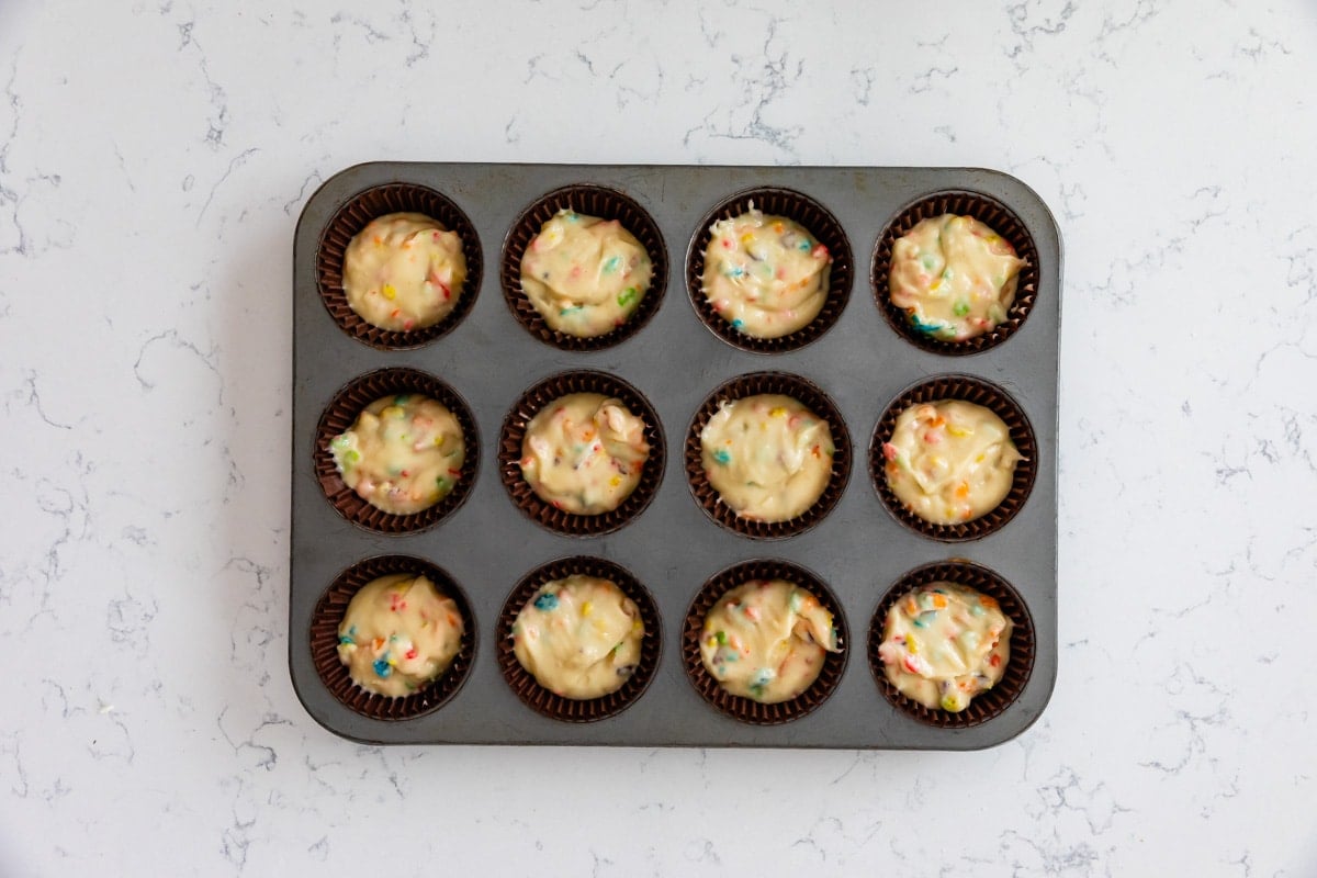 process shot of fruity pebble muffins.