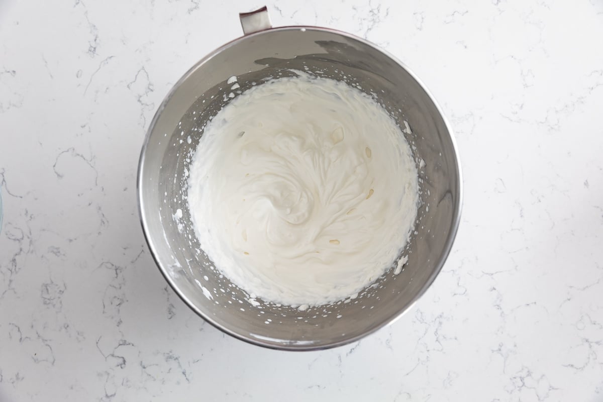 whipped cream in metal bowl.