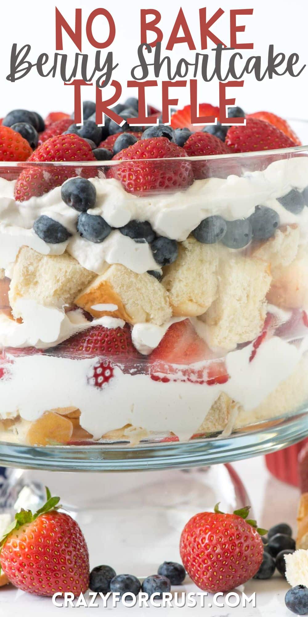 trifle mixed with strawberries and blueberries and bread in a clear jar with words in the image.