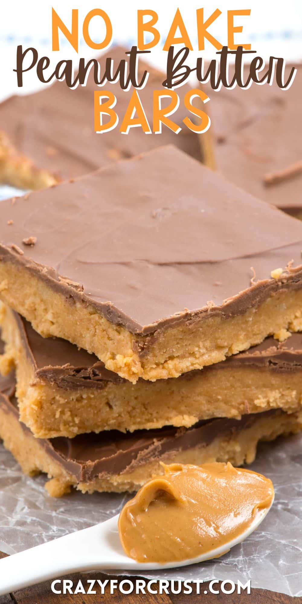 stacked peanut butter bars next to a spoonful of peanut butter with words on the image.