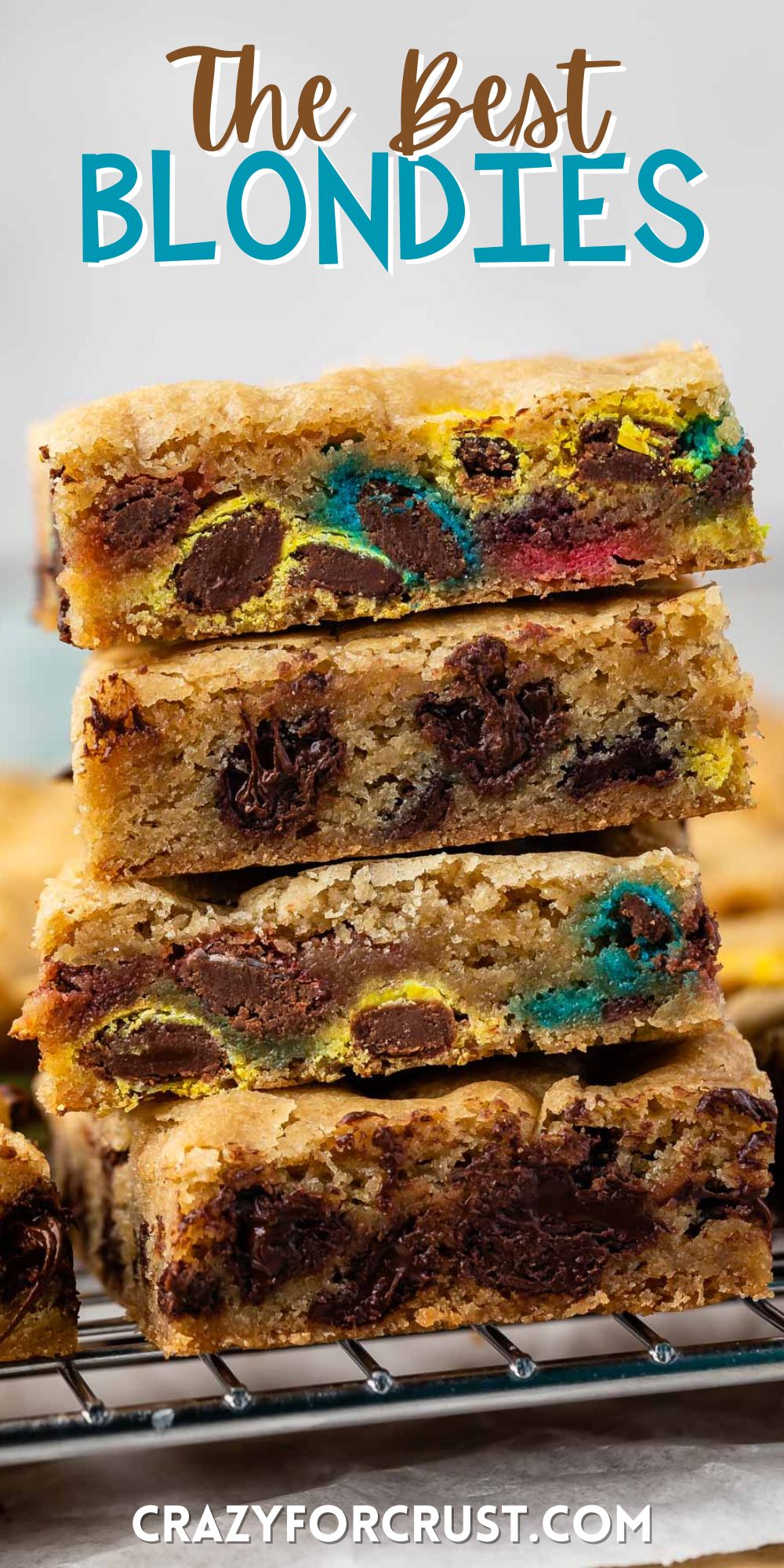 stacked blondies with m&ms baked in with words on the image.