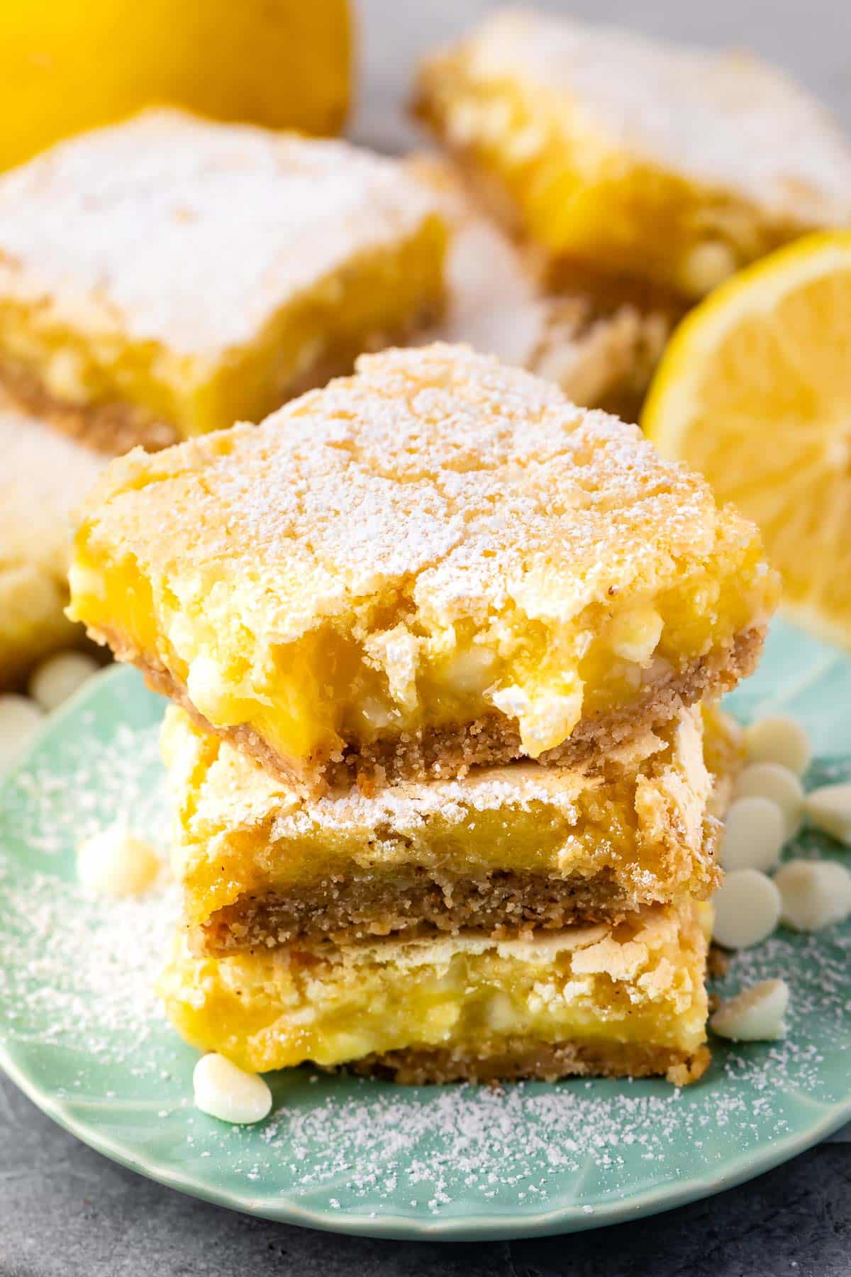 stacked lemon bars topped with powdered sugar.