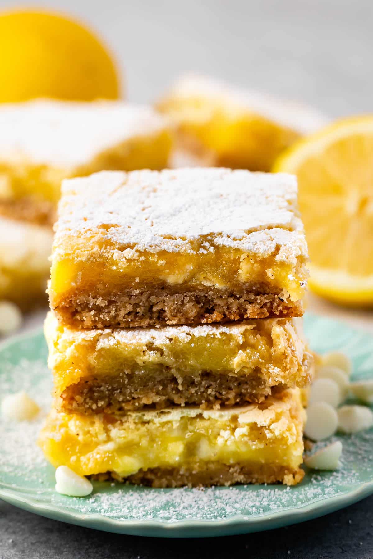 stacked lemon bars topped with powdered sugar.