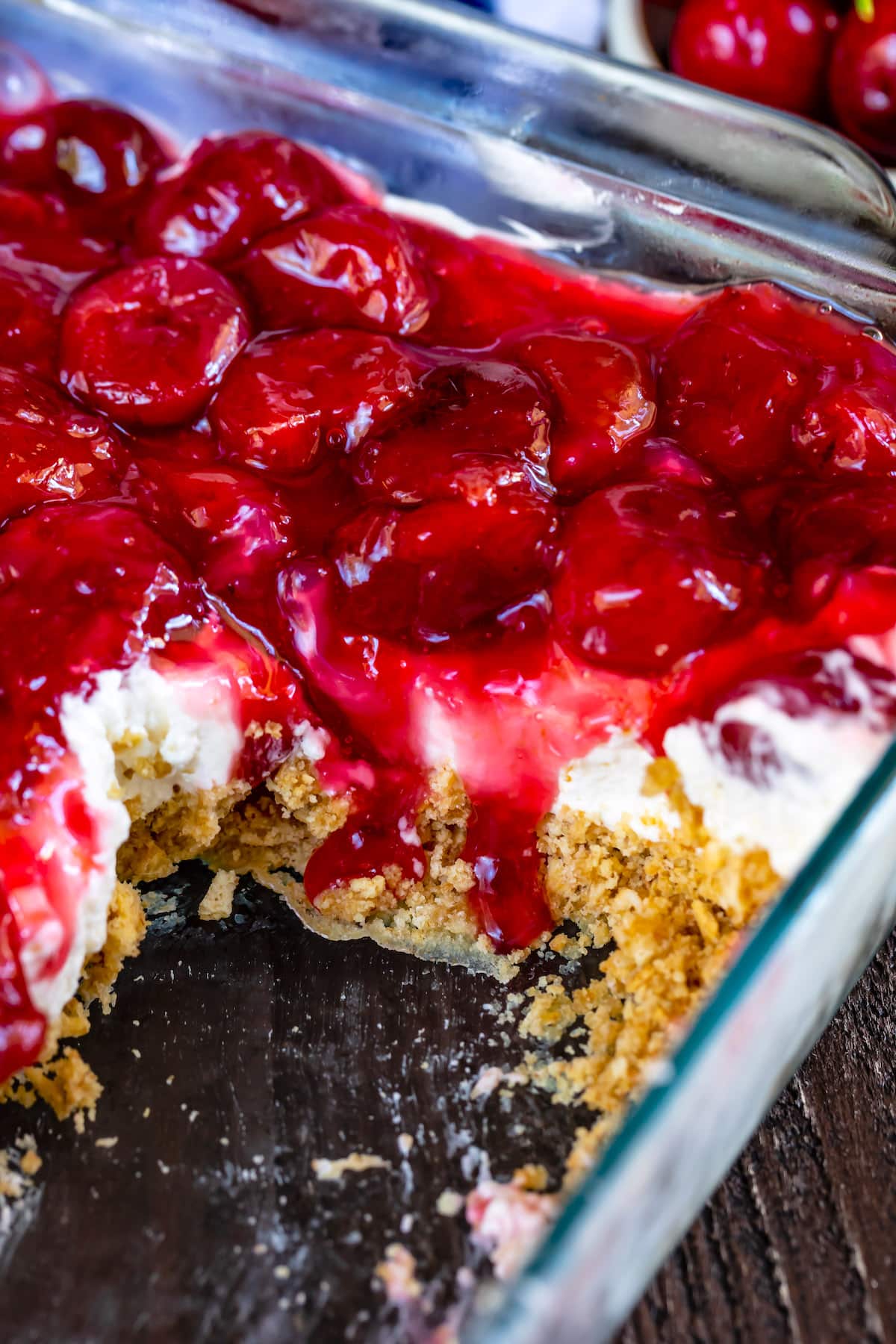 charm cracker crust topped with cherry pie filling on a plate.