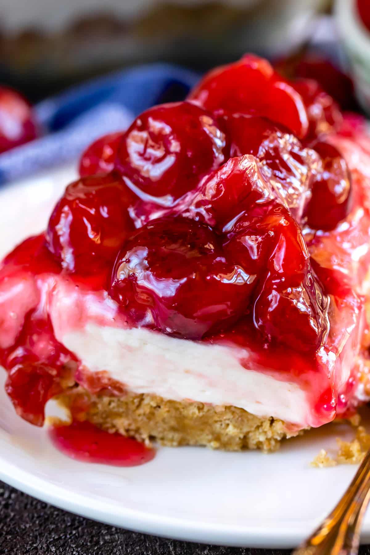 charm cracker crust topped with cherry pie filling on a plate.