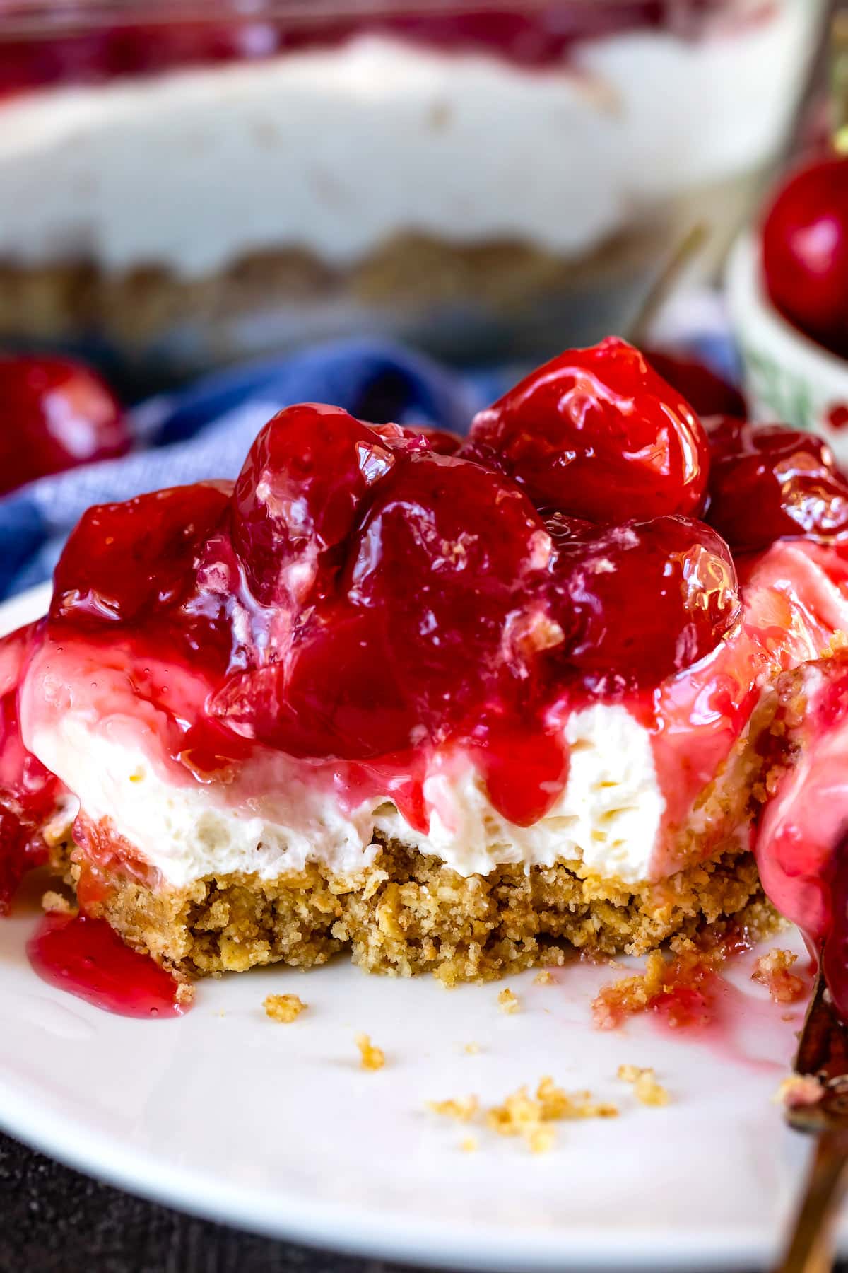 charm cracker crust topped with cherry pie filling on a plate.