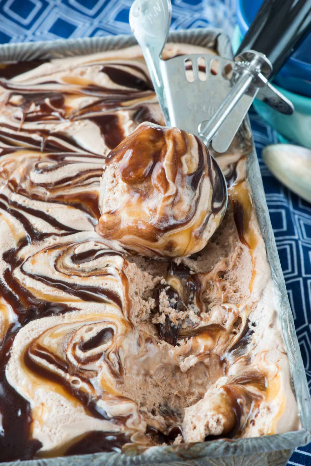 ice cream swirled with chocolate and caramel sauce.