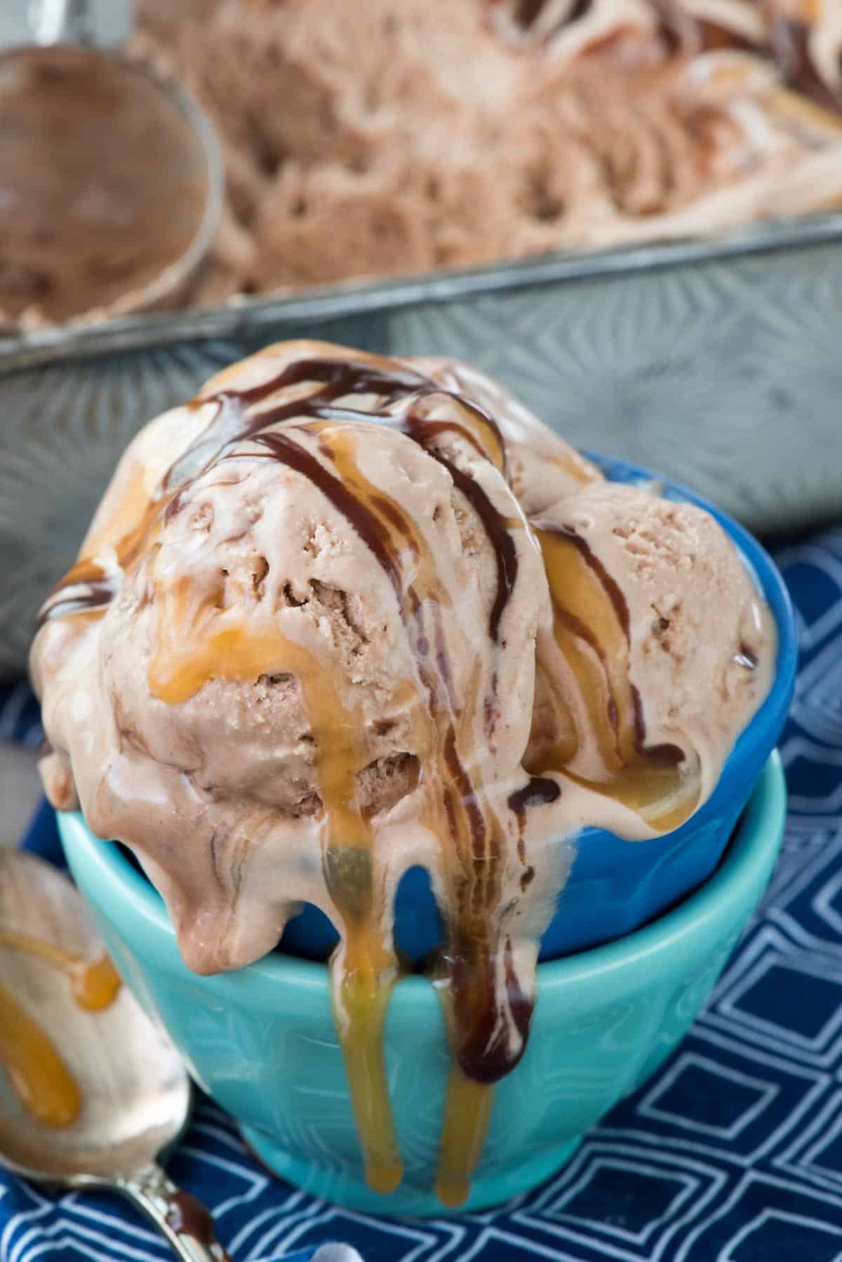 ice cream swirled with chocolate and caramel sauce.