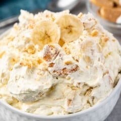 banana fluff in a white bowl with banana slices on top.