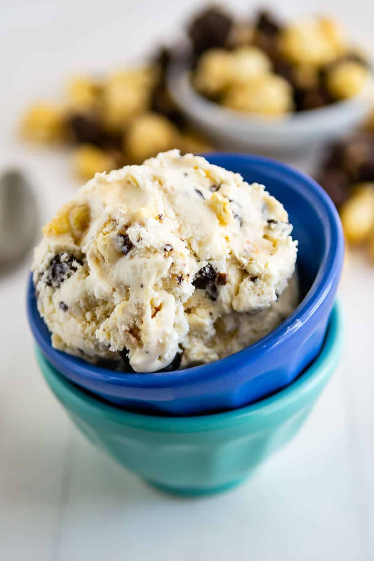 stacked blue bowls with ice cream in the bowls.