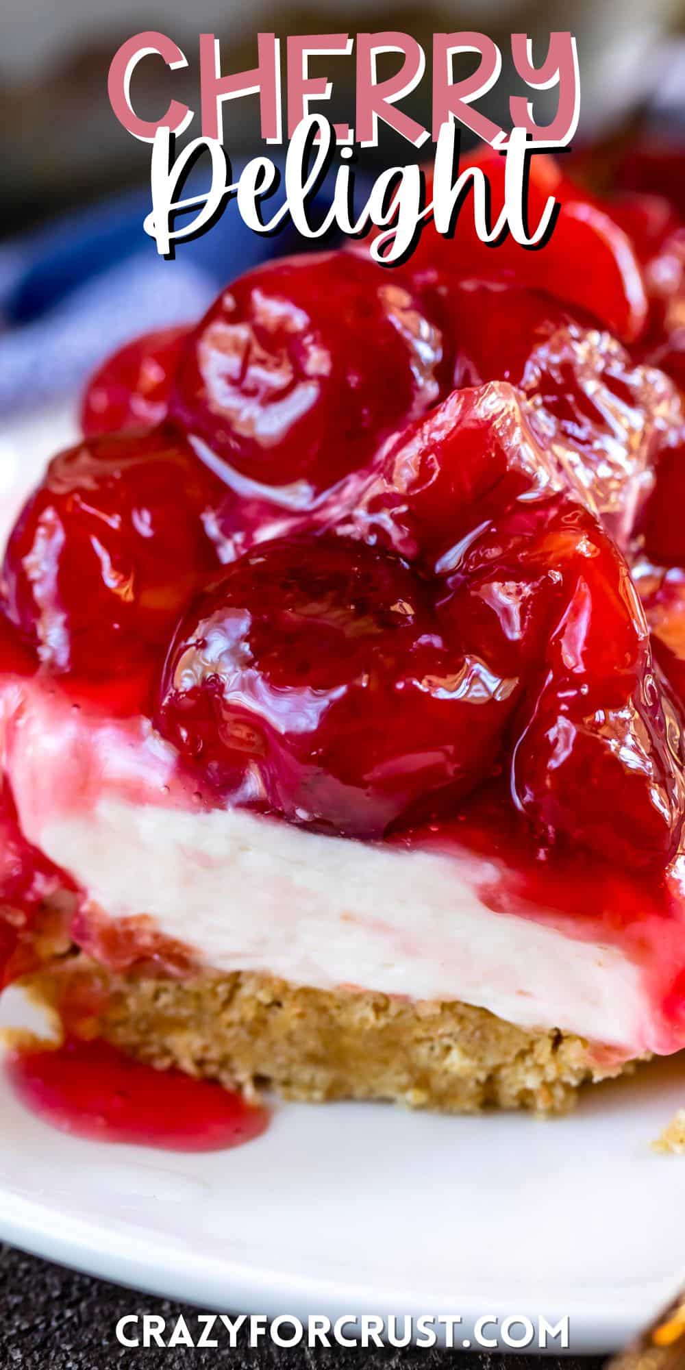 charm cracker crust topped with cherry pie filling on a plate with words on the image.