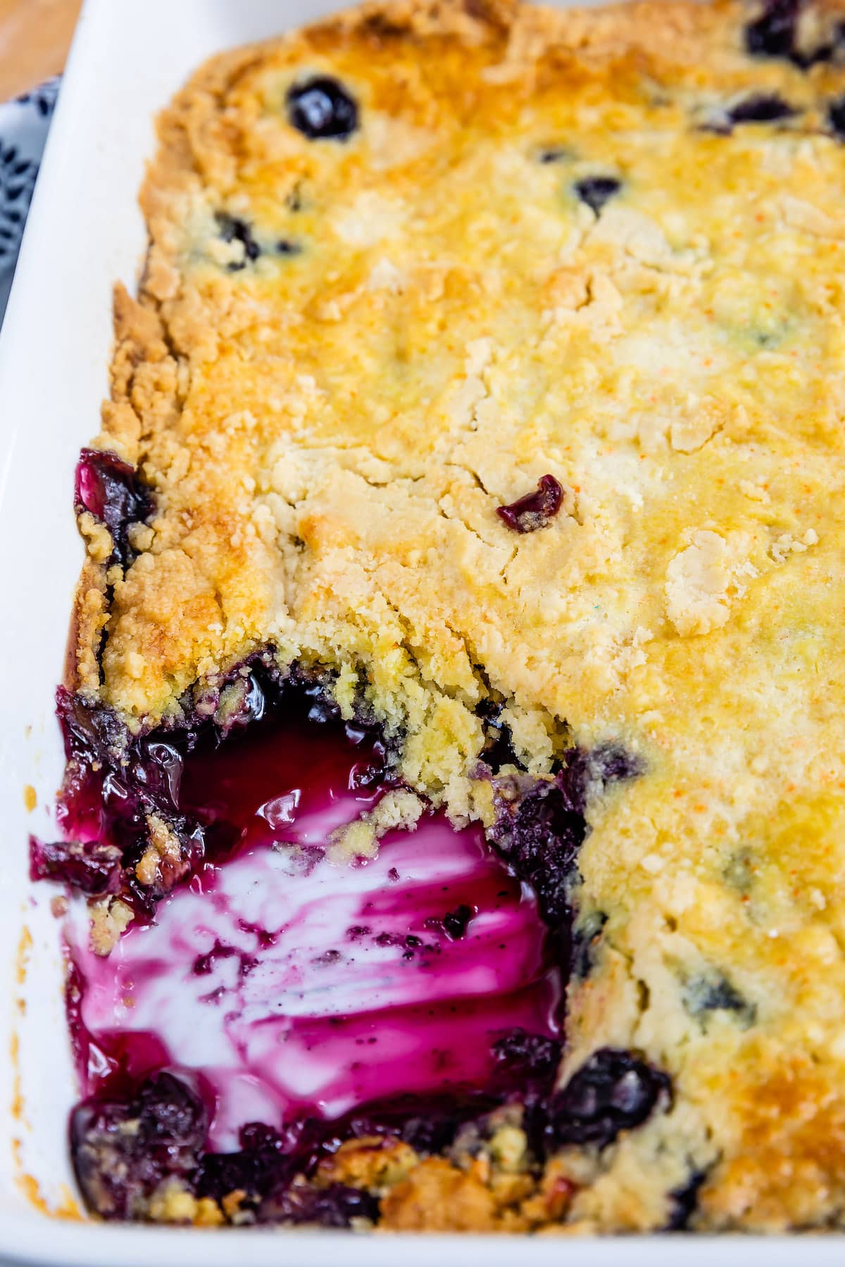 cobbler with a scoop taken out of it in a white glassware.