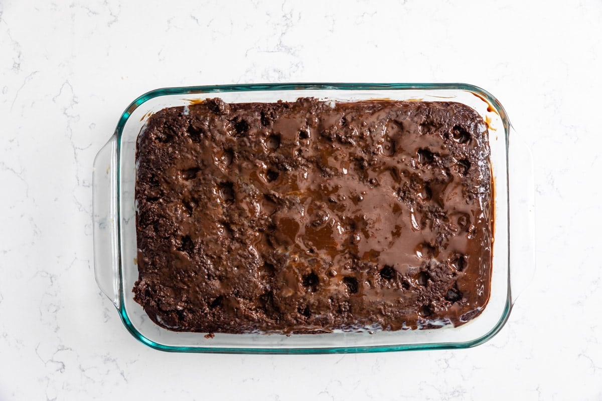 process shot of cherry coke poke cake.