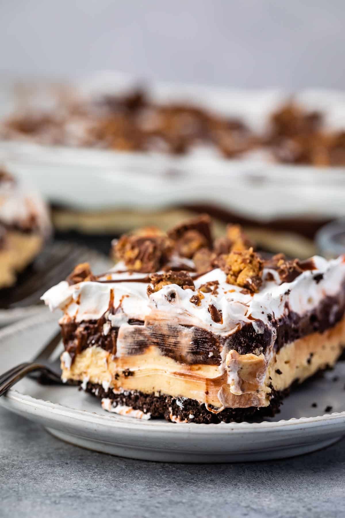 peanut butter and chocolate layered on a grey plate.