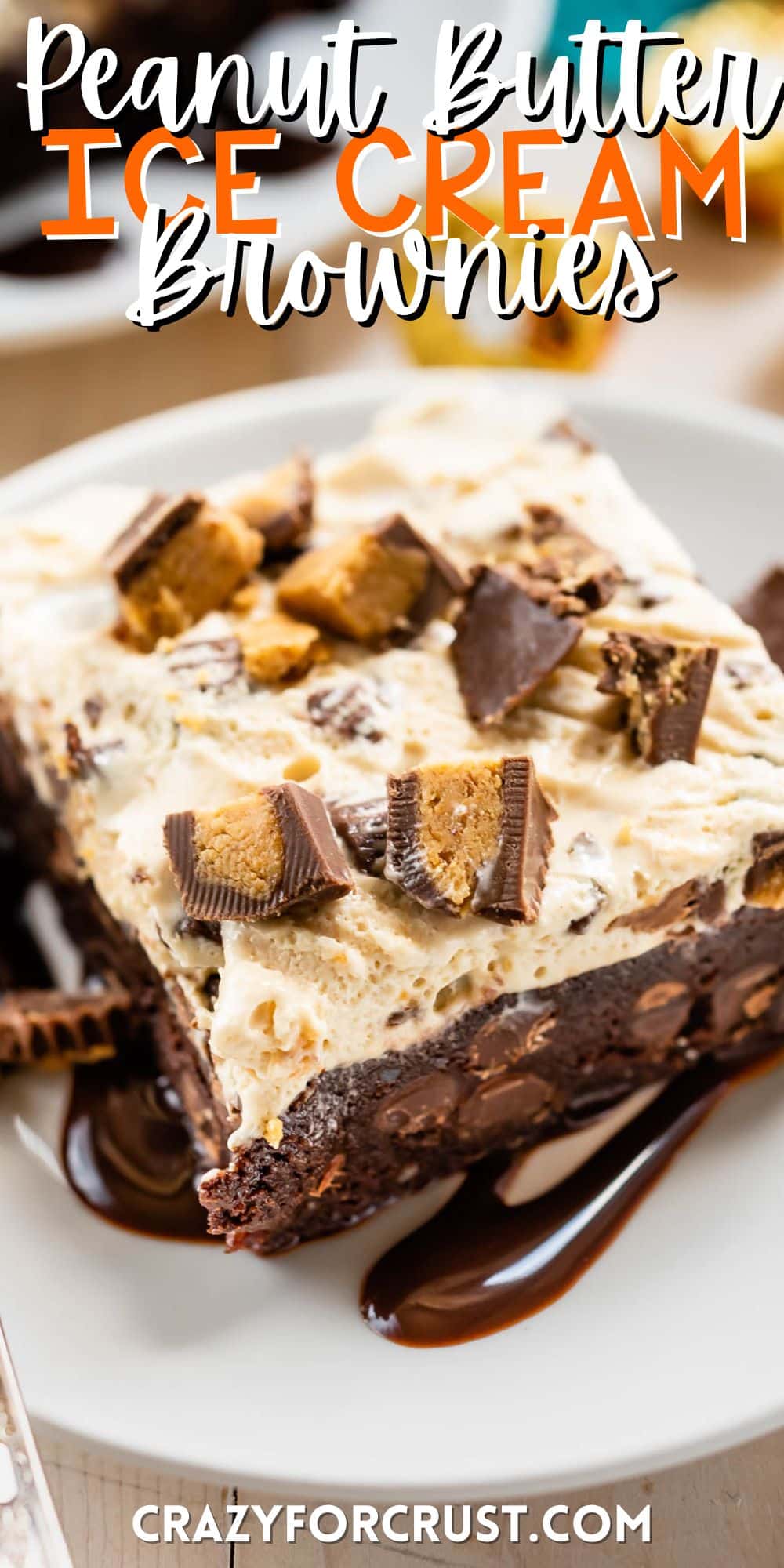 square slice of ice cream brownies on a white plate next to a fork with words on the image with words on the image.