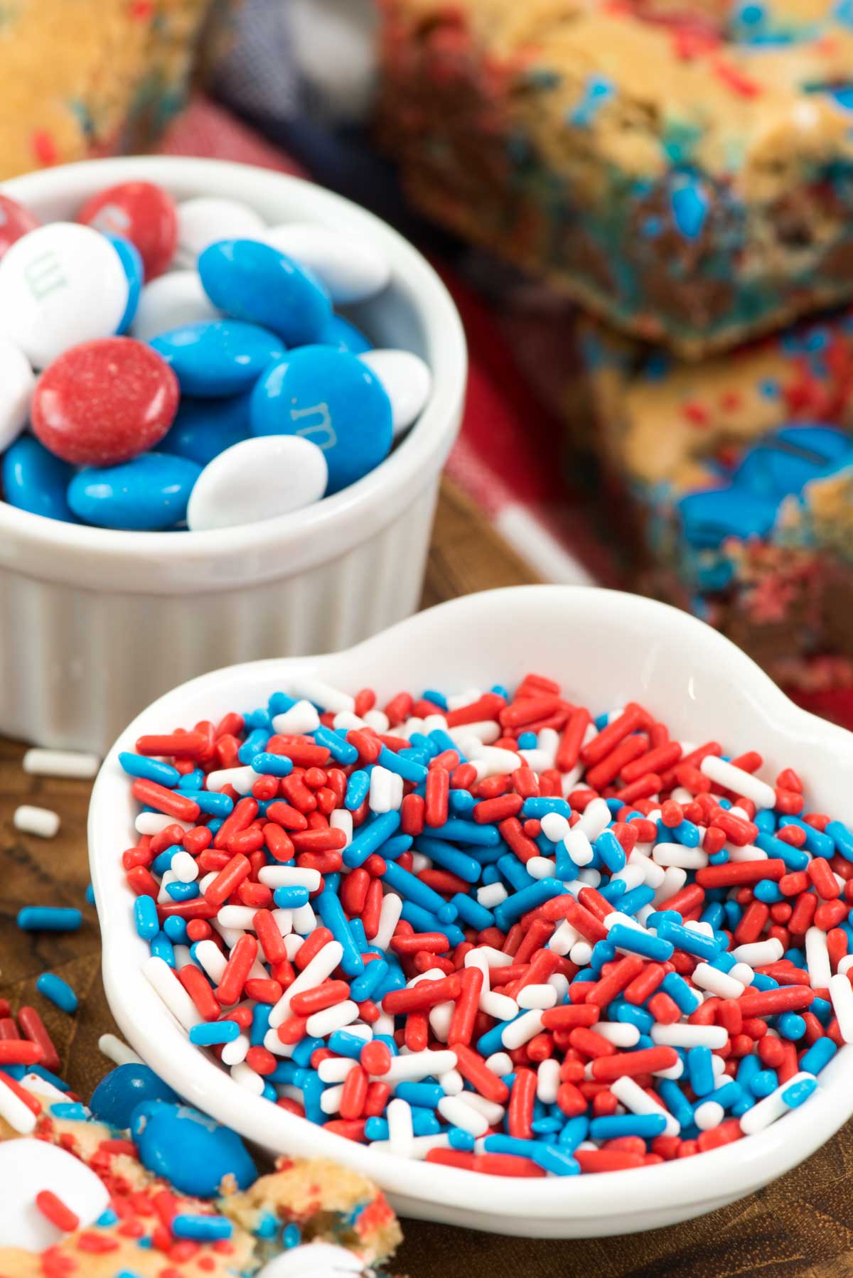 red white and blue sprinkles and candy on a white plate.