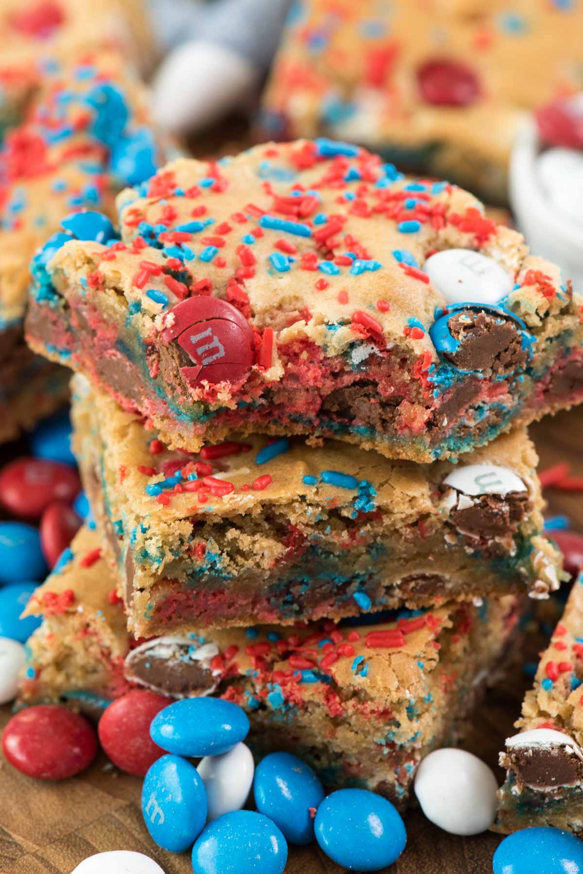 stacked blondies with red white and blue sprinkles mixed in.