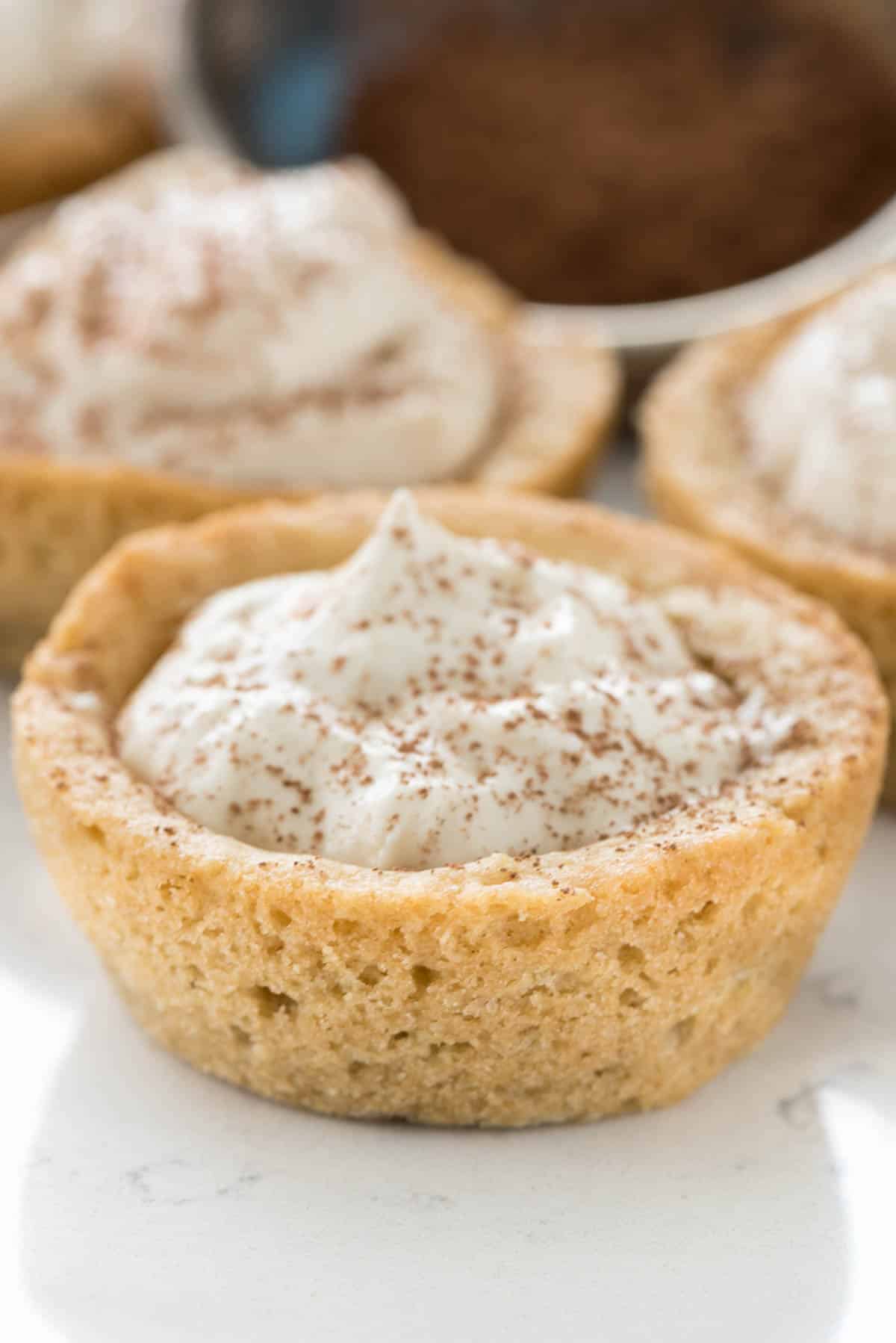 tiramisu in a cookie that shaped like a small cup.