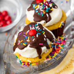 banana split cupcakes in a clear ice cream tray.