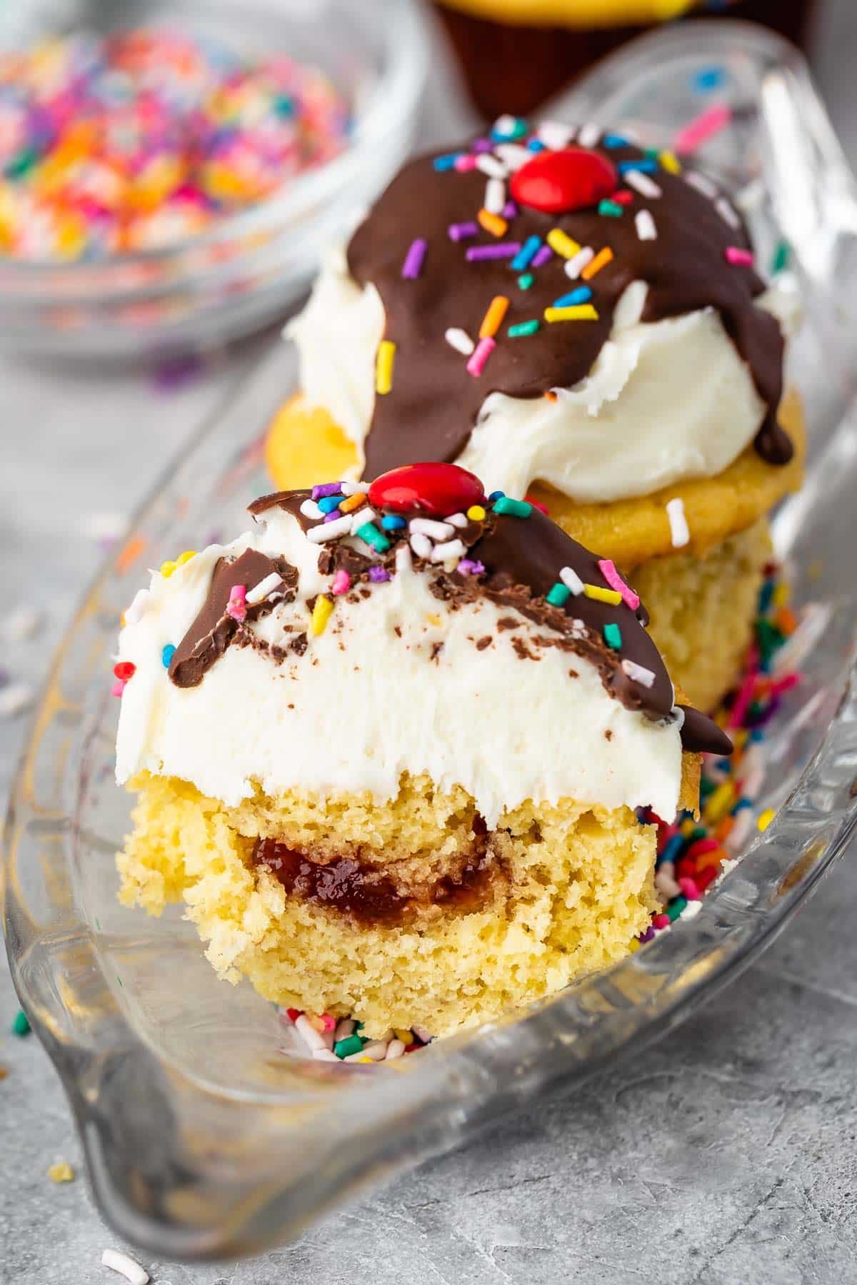 banana split cupcakes in a clear ice cream tray.