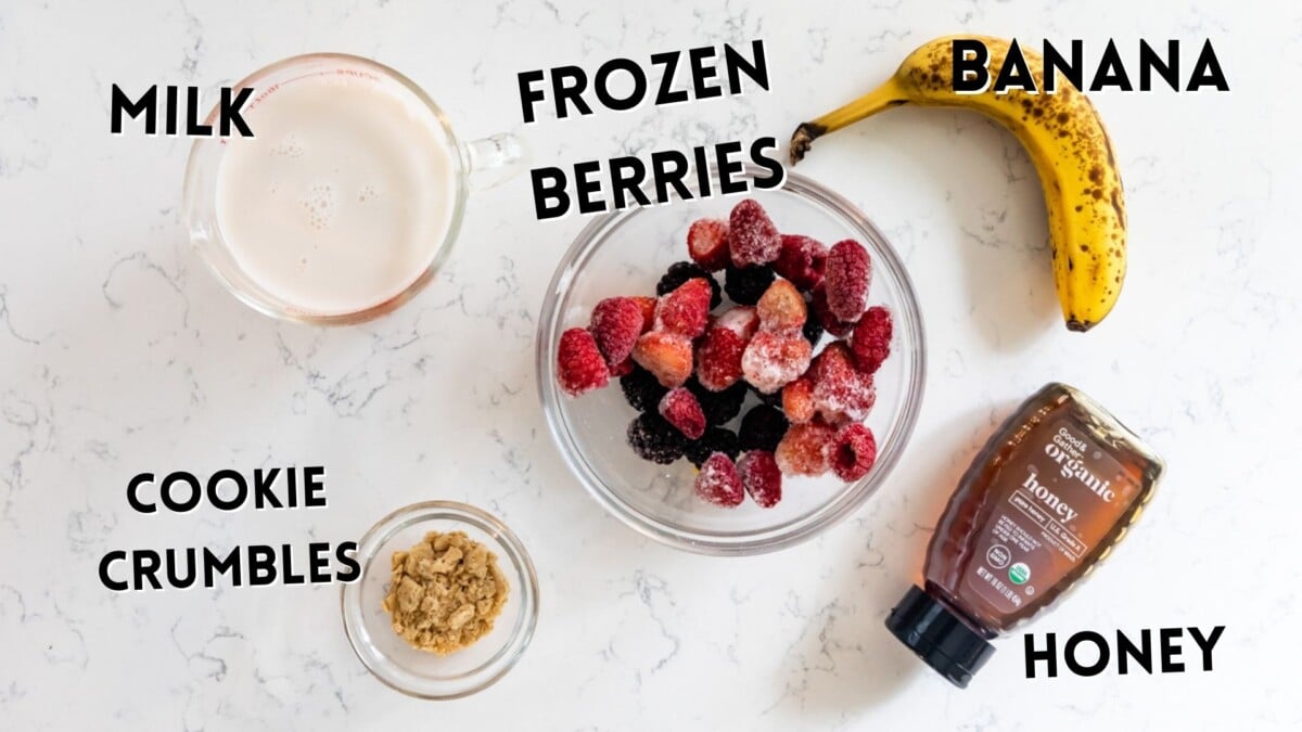 ingredients in berry smoothie laid out.