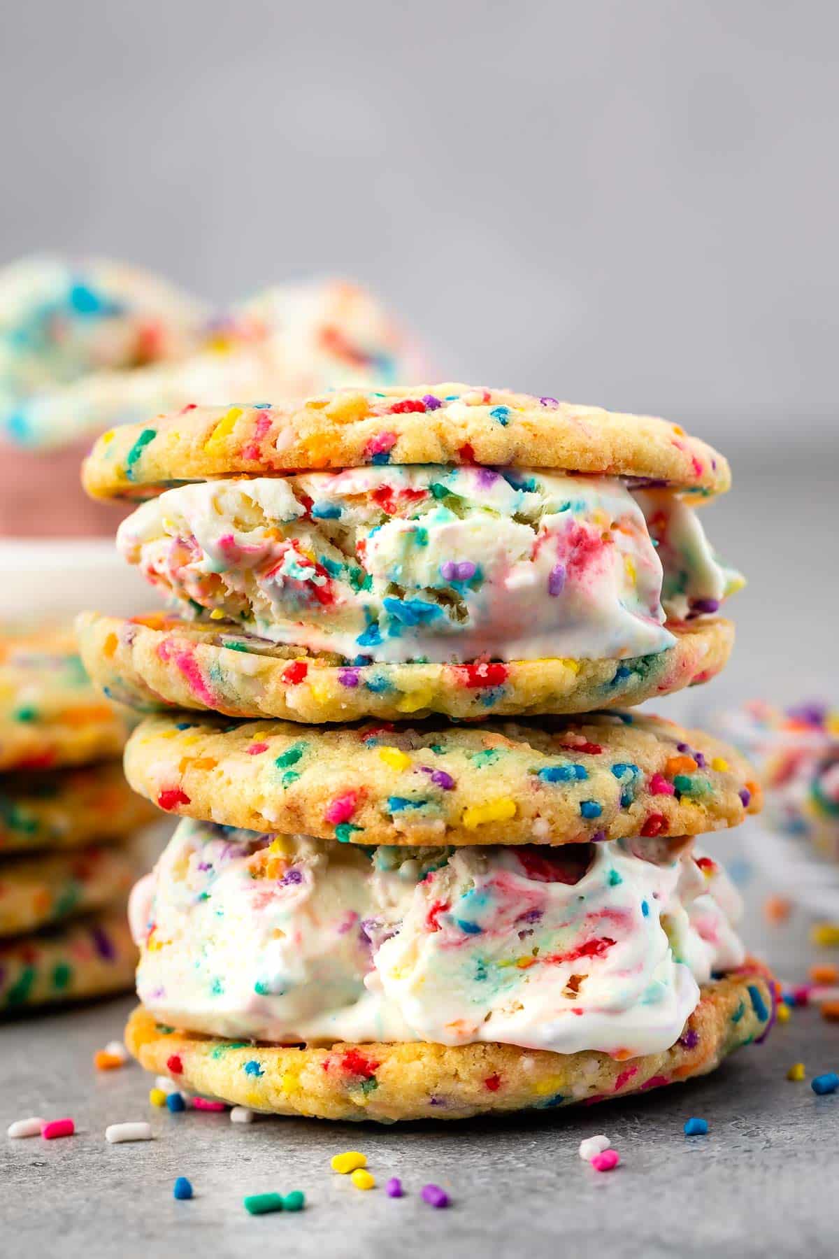 cake batter ice cream sandwiched between to cookies with sprinkles baked in.