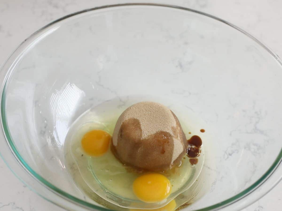 bowl with oil, brown sugar, eggs and vanilla