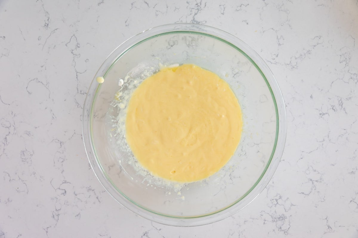 process shot of strawberry cheesecake cupcakes.