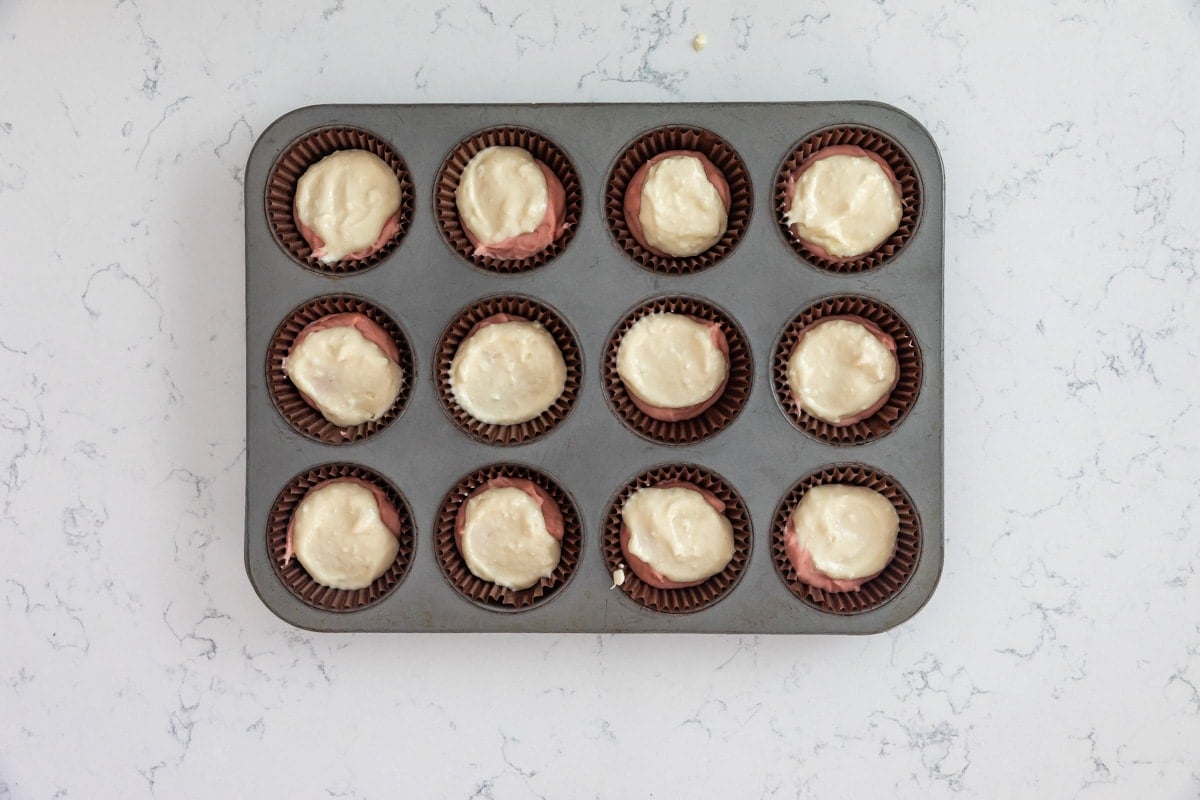 process shot of strawberry cheesecake cupcakes.