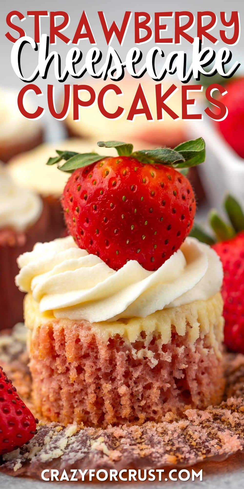 cupcake with white frosting and a strawberry on top with words on the image.