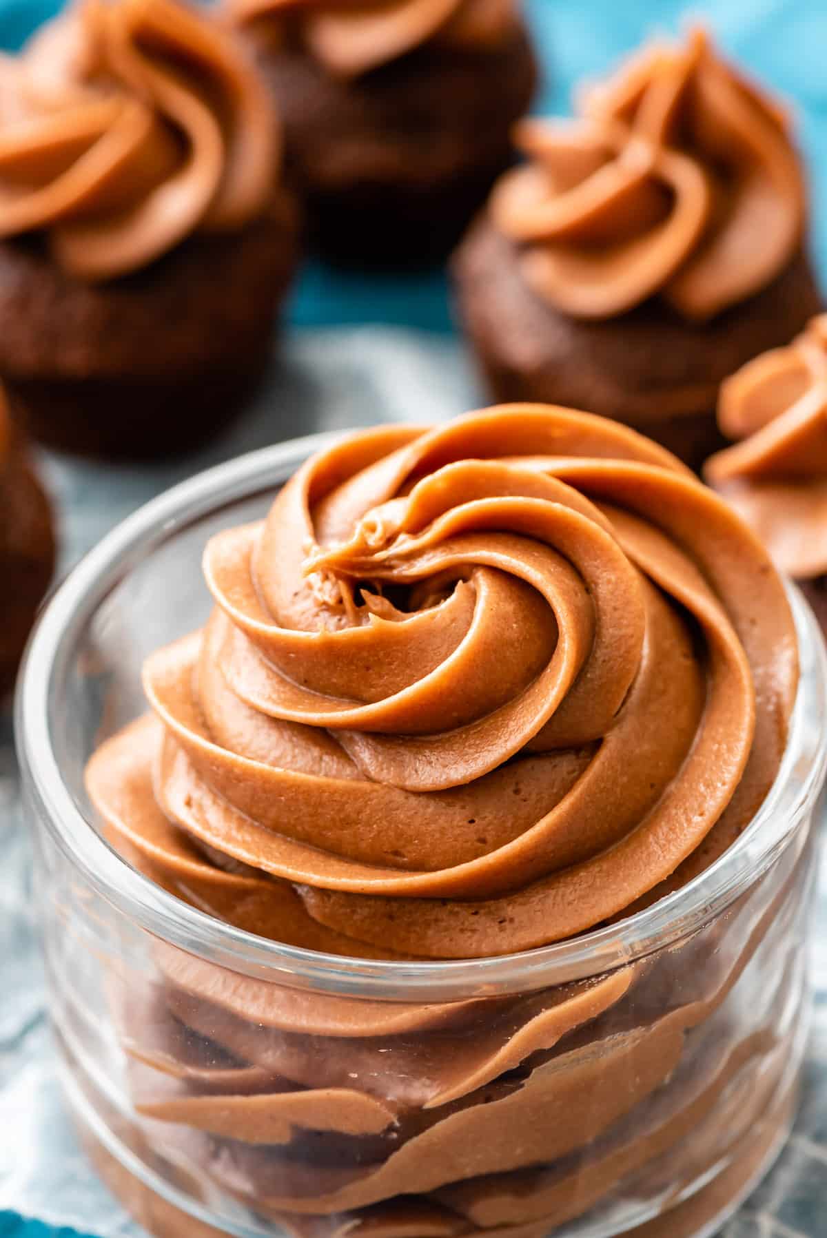 chocolate cream cheese frosting in a clear jar.