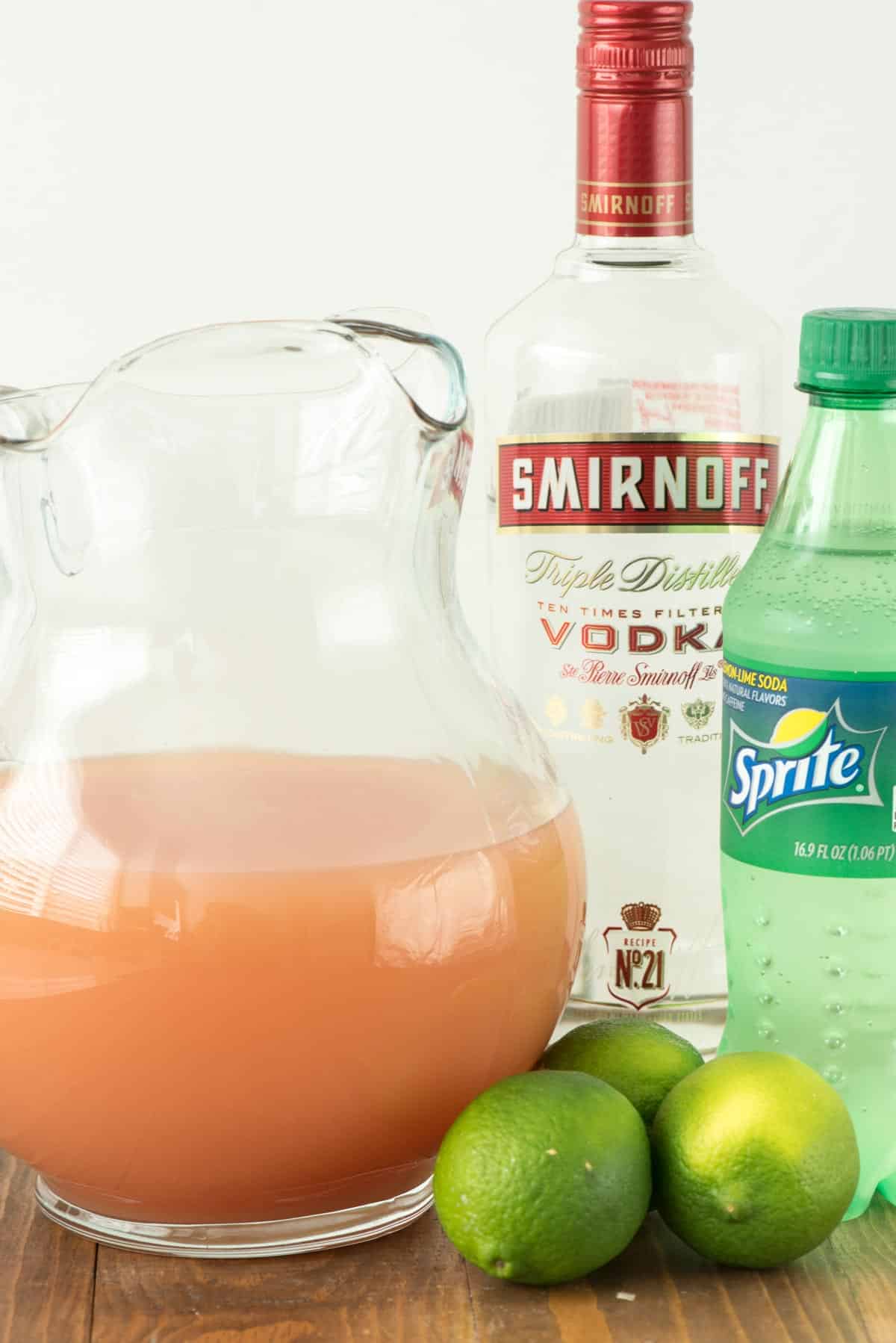 ingredients in salty dog punch laid out on a wood surface.