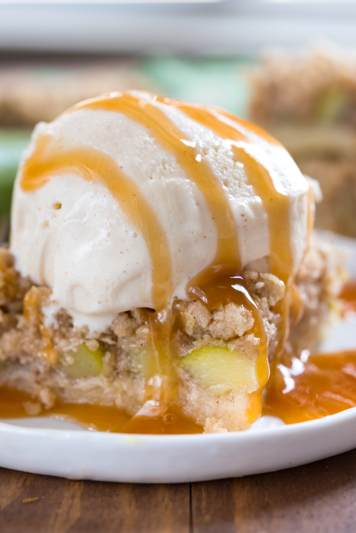 stacked zucchini bars with zucchini baked in and topped with ice cream.