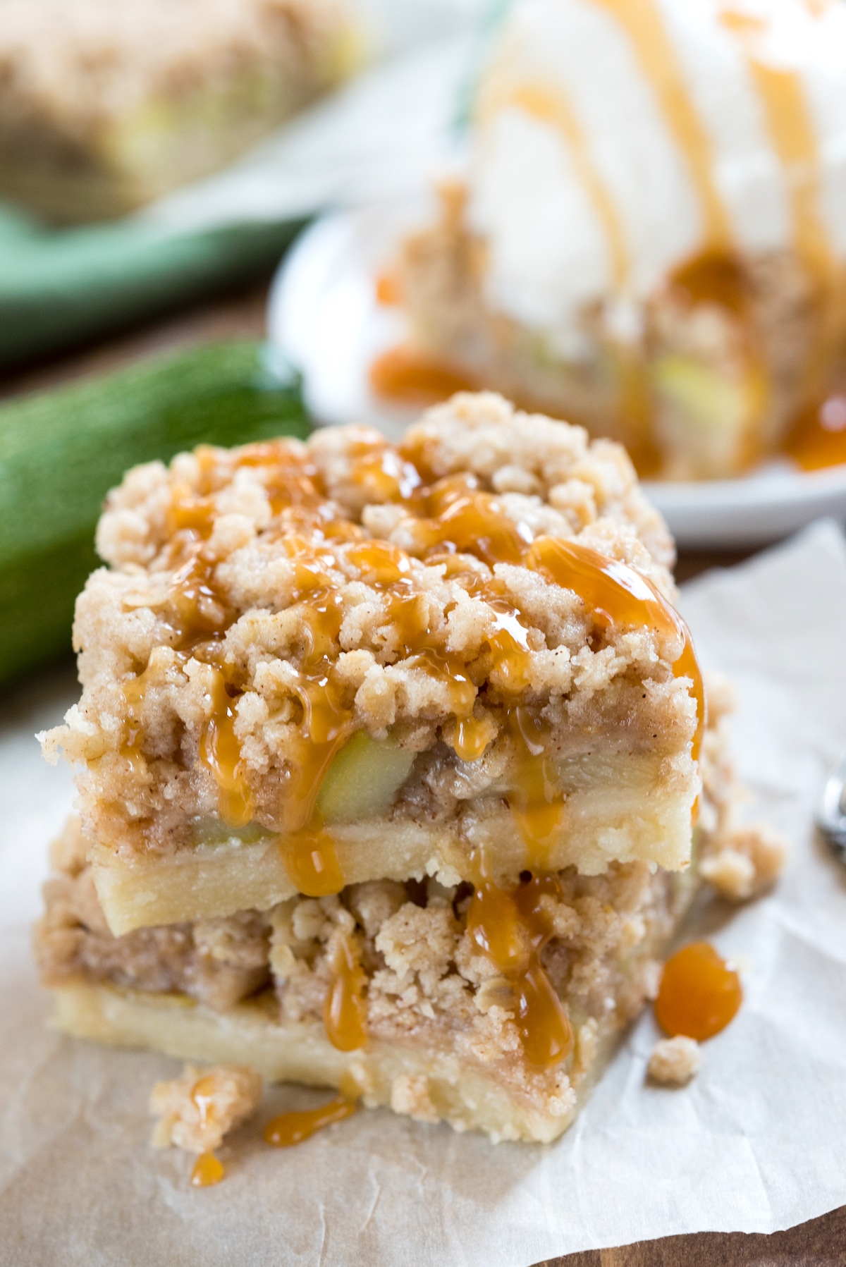 stacked zucchini bars with zucchini baked in and a crumble topping.