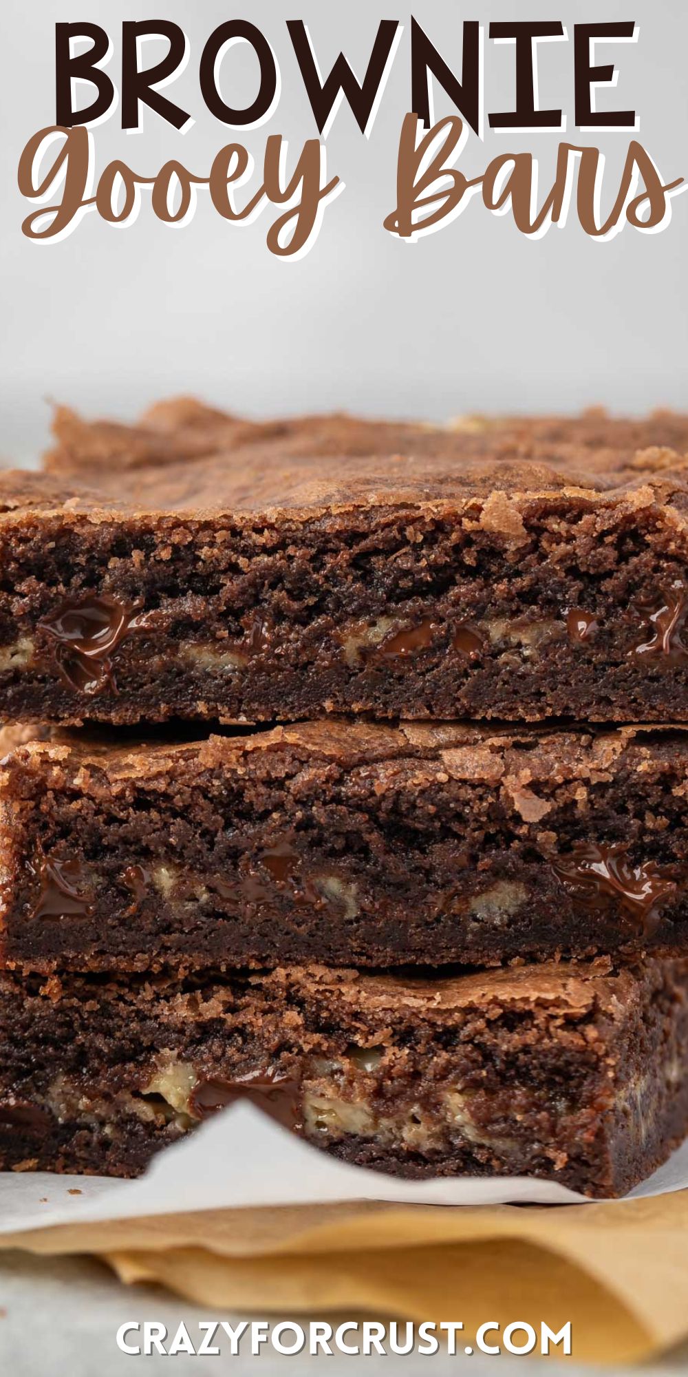 stacked brownies with chocolate chips baked in with words on the image.