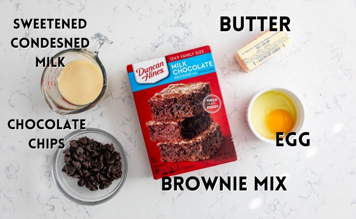 ingredients in brownie gooey bars laid out on a marble counter.