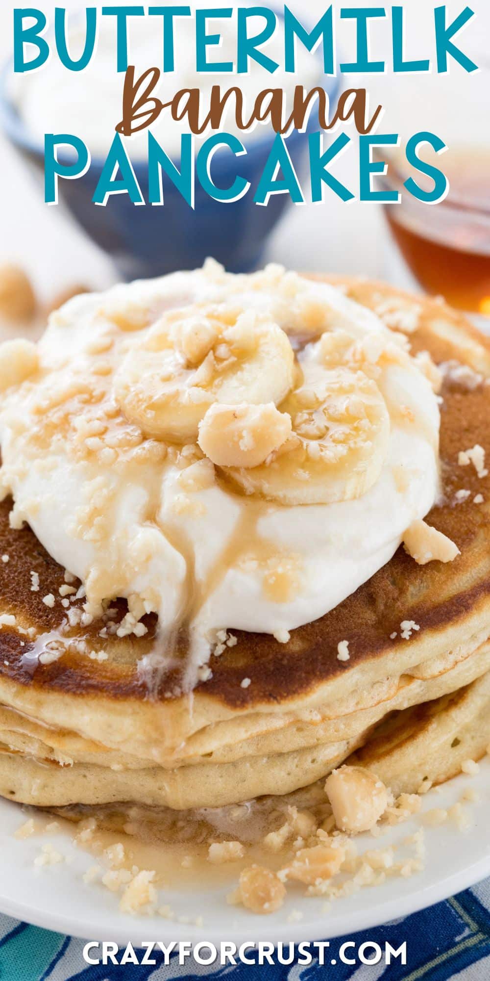 stacked pancakes on a white plate with banana slices on top with words on the image.