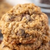 stacked cookies with coconut and chocolate chips and pecans baked in with words on the image.