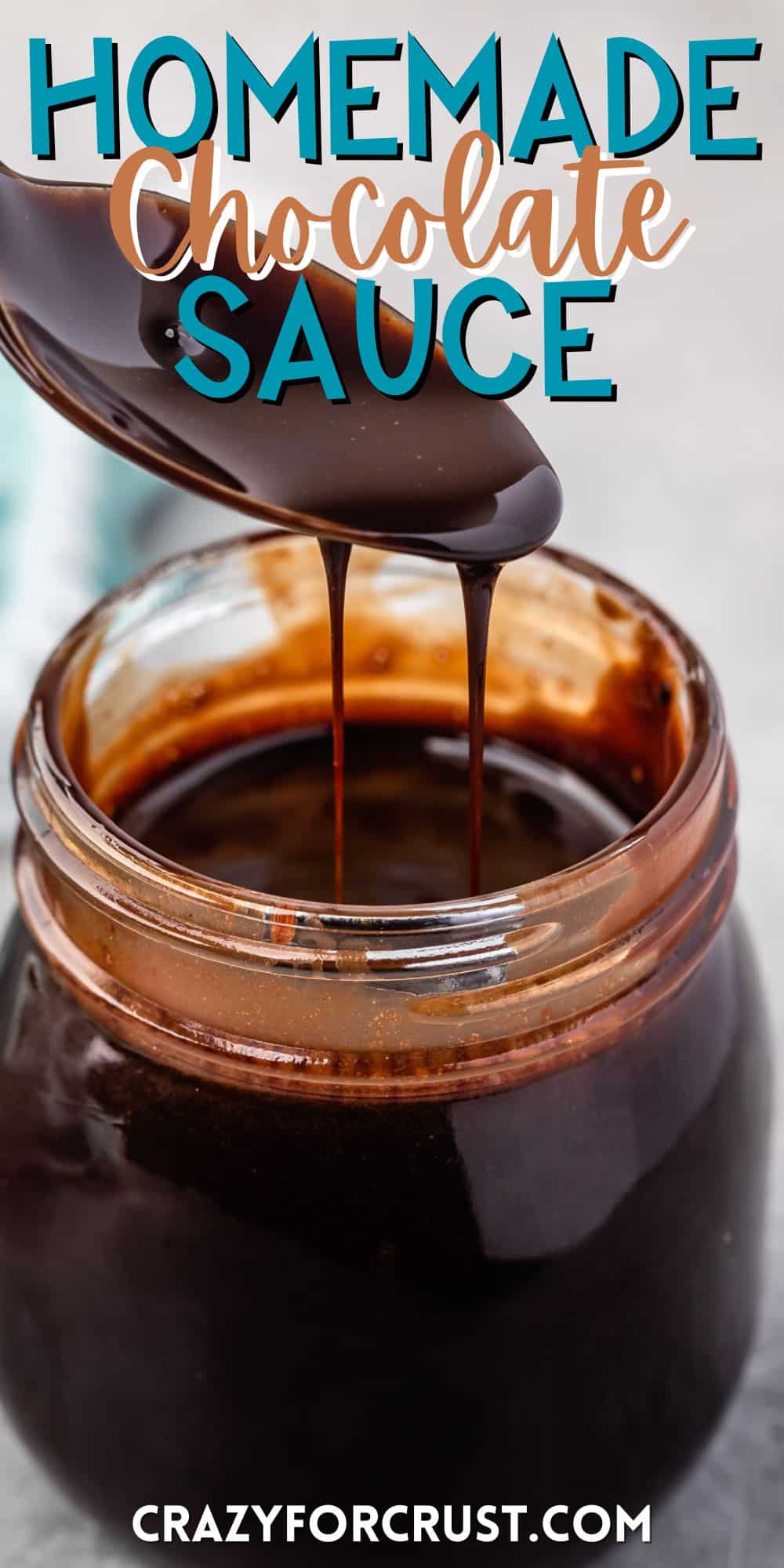 a spoon scooping chocolate sauce out of a clear jar with words on the image.