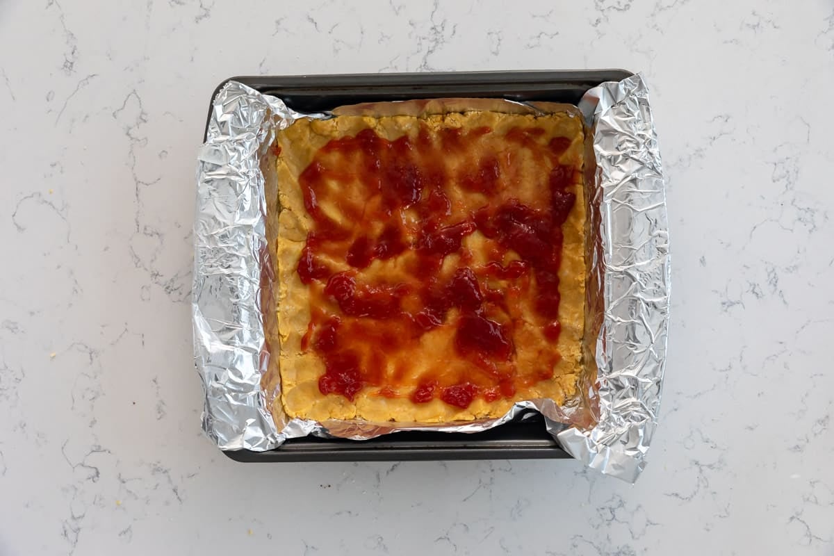 process shot of peanut butter and jelly bars.